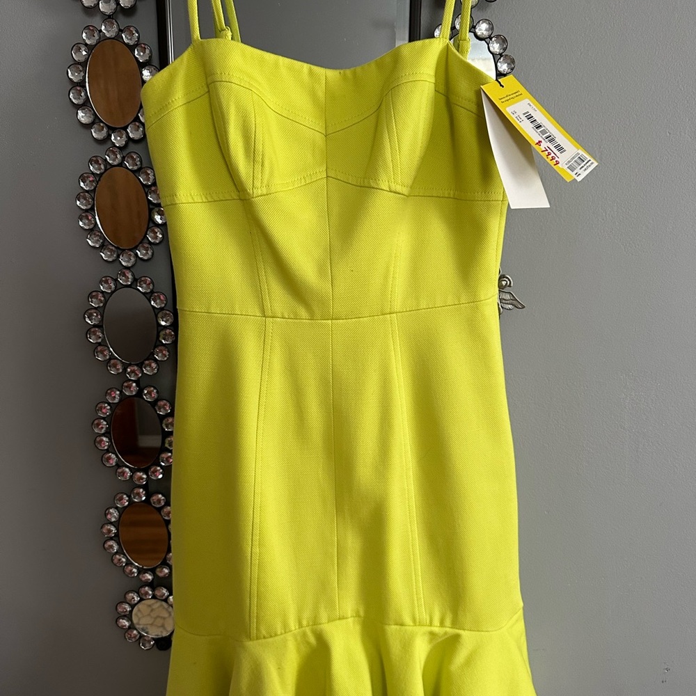 Karen Millen lime green straight ruffled bottom dress.
